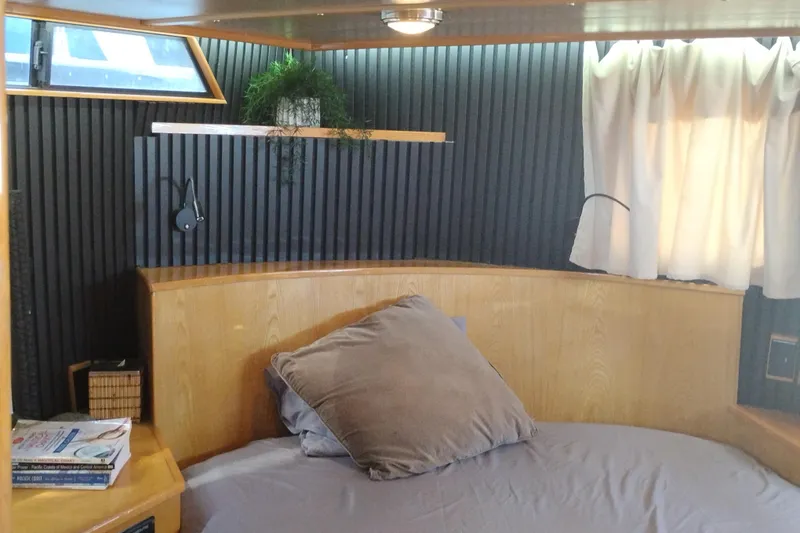 Slide: The Image of Cozy cabin interior of 1988 PT 52 AFT Motor Yacht with bed and window. - 58