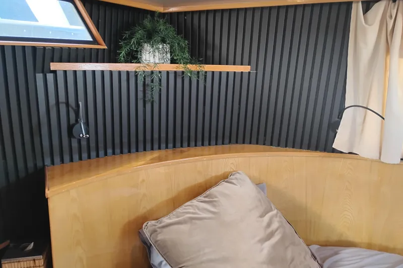 Slide: The Image of Cozy cabin interior of 1988 PT 52 AFT Motor Yacht with wood accents and decor. - 59