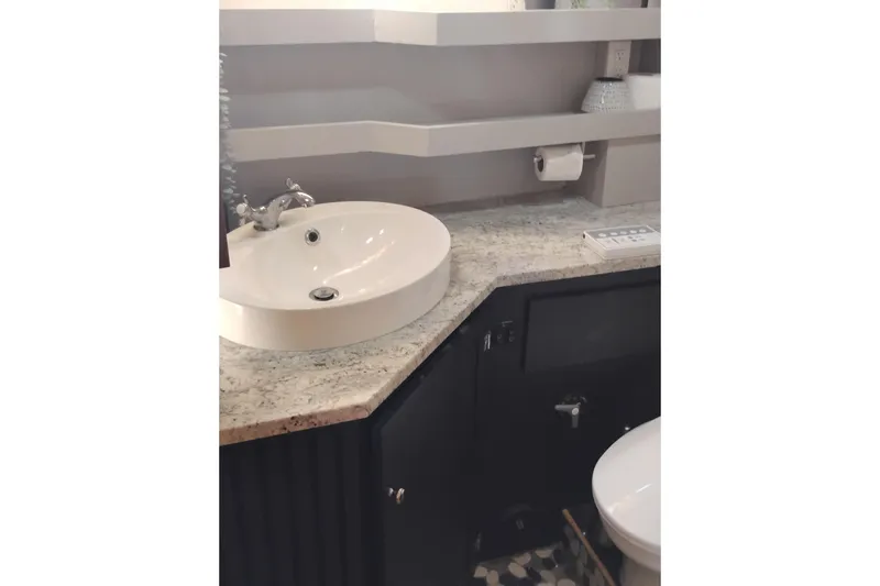 Slide: The Image of Bathroom interior of 1988 PT 52 AFT Cabin Motor Yacht with modern sink and countertop. - 64