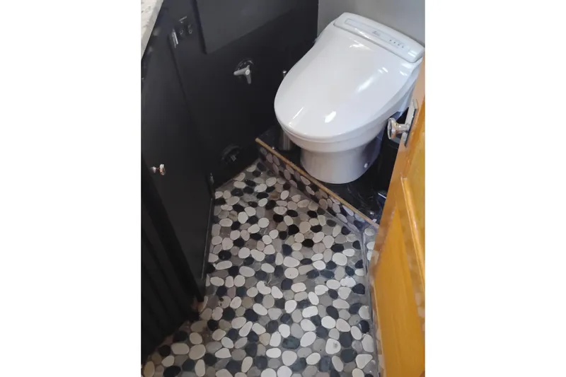 Slide: The Image of Bathroom interior of 1988 PT 52 AFT Cabin Motor Yacht with modern toilet and mosaic floor. - 65
