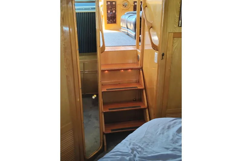 Slide: The Image of Interior stairs of 1988 PT 52 AFT Cabin Motor Yacht with wooden finish. - 69