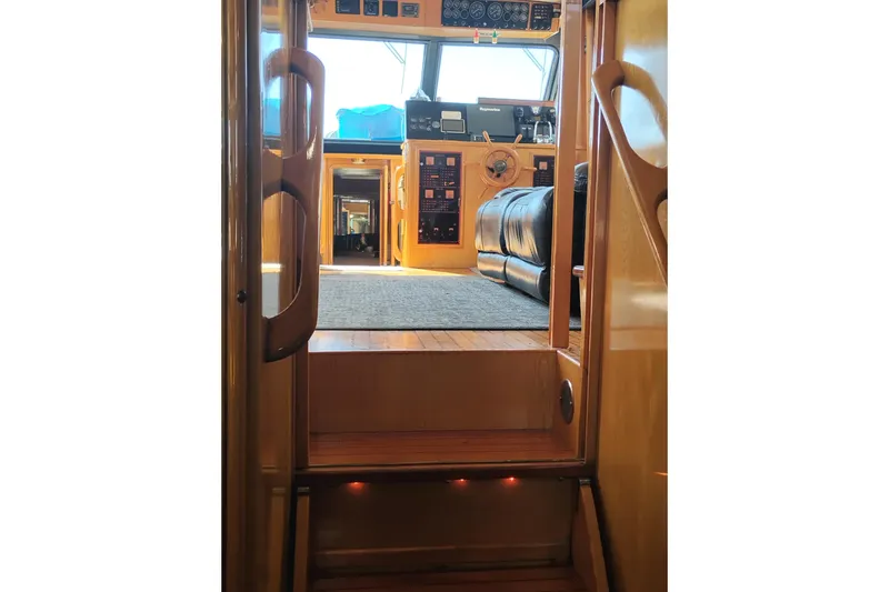 Slide: The Image of Interior view of 1988 PT 52 AFT Cabin Motor Yacht, showcasing helm and seating area. - 70