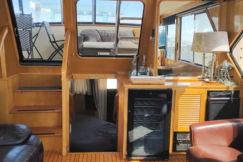 Slide: The Image of Interior of 1988 PT 52 AFT Cabin Motor Yacht with cozy seating and kitchenette. - 71