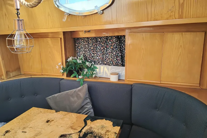 Slide: The Image of Cozy interior of 1988 PT 52 AFT Cabin Motor Yacht with wooden cabinetry and seating. - 75