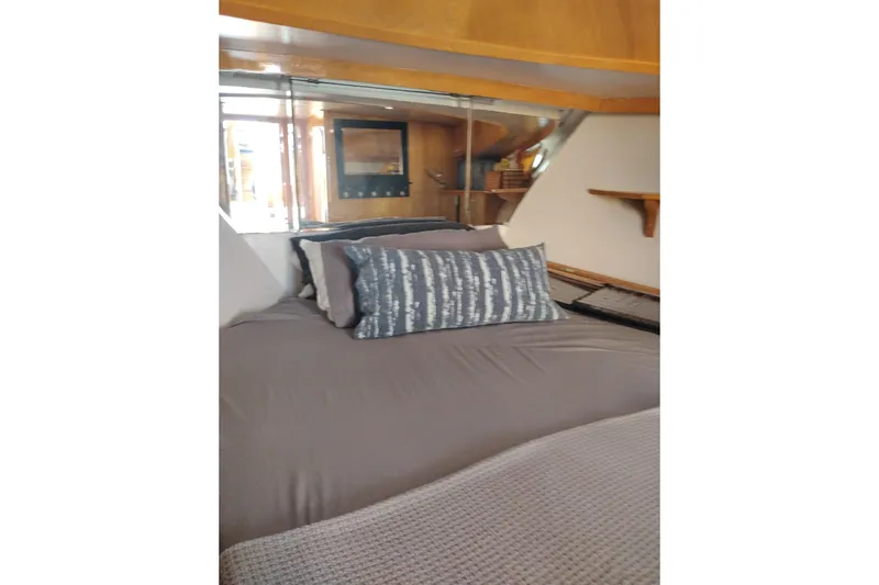 Slide: The Image of Cozy bedroom interior of 1988 PT 52 AFT Cabin Motor Yacht with stylish bedding. - 88