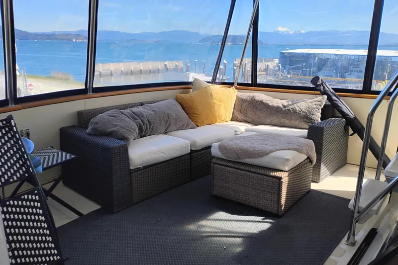 Slide: The Image of Cozy seating area on 1988 PT 52 AFT Cabin Motor Yacht with ocean view. - 9