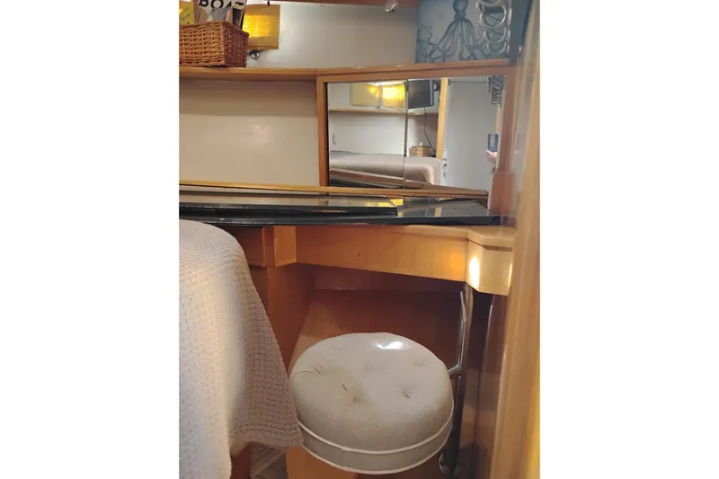 Slide: The Image of Interior of 1988 PT 52 AFT Cabin Motor Yacht with vanity and stool. - 90