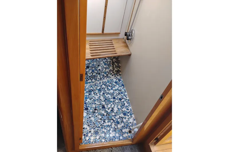 Slide: The Image of Shower area in 1988 PT 52 AFT Cabin Motor Yacht with mosaic floor tiles. - 92