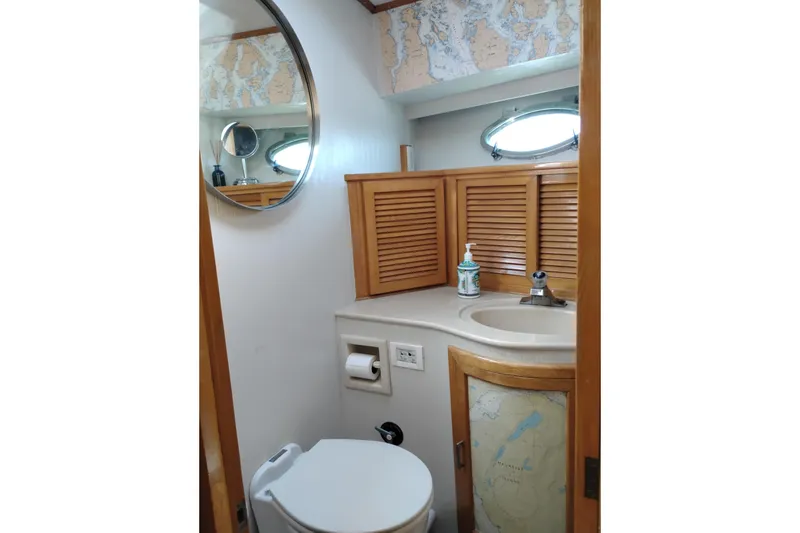 Slide: The Image of Bathroom interior of 1988 PT 52 AFT Cabin Motor Yacht with nautical decor. - 95