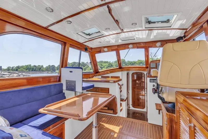 Slide: The Image of Luxurious interior of 2007 Gorbon Custom Downeast 40 yacht with wood finish and seating. - 18