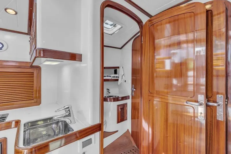 Slide: The Image of Luxurious interior of 2007 Gorbon Custom Downeast 40 yacht with wood finishes and modern amenities. - 28