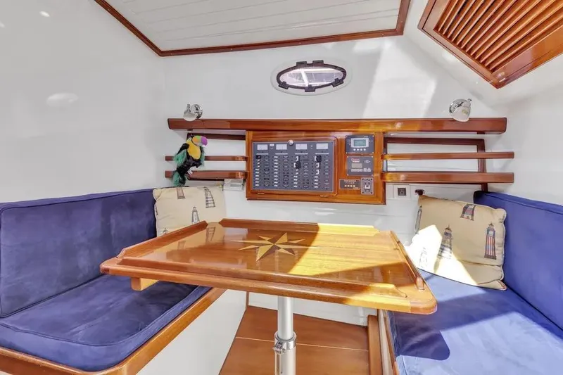 Slide: The Image of Cozy interior of 2007 Gorbon Custom Downeast 40 with plush seating and nautical decor. - 30