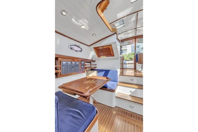 Slide: The Image of Interior of 2007 Gorbon Custom Downeast 40 yacht with wooden finishes and blue seating. - 37