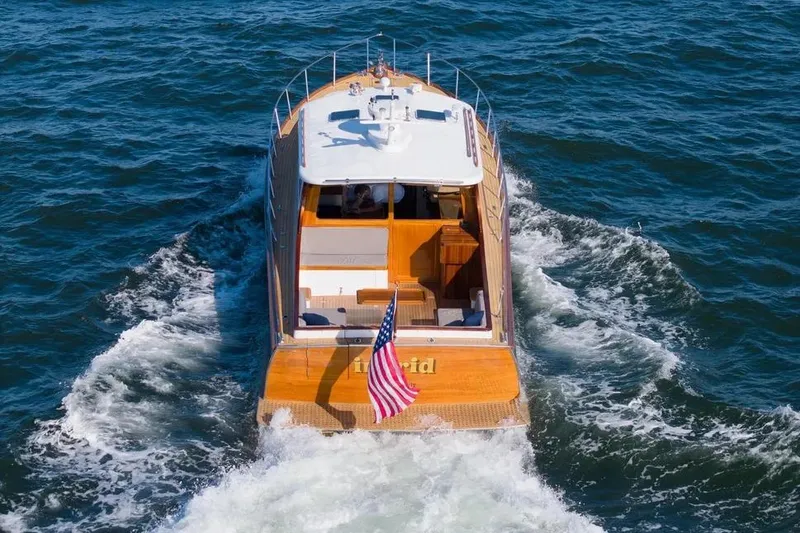 Slide: The Image of Gorbon Custom Downeast 40 yacht cruising on open water, rear view, 2007 model. - 9