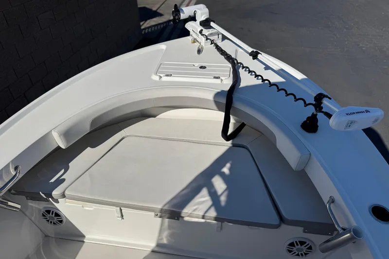 Slide: The Image of 2023 Parker 21SE Center Console boat interior with seating and trolling motor. - 13