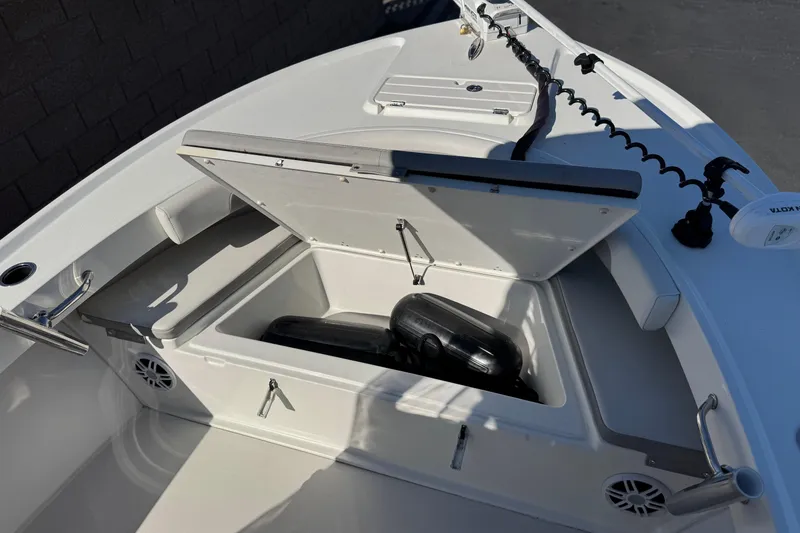 Slide: The Image of 2023 Parker 21SE Center Console boat with open storage compartment and seating area. - 15
