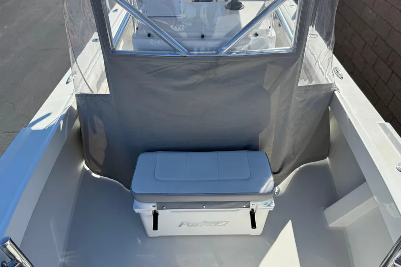 Slide: The Image of 2023 Parker 21SE Center Console boat interior with seating and storage. - 17