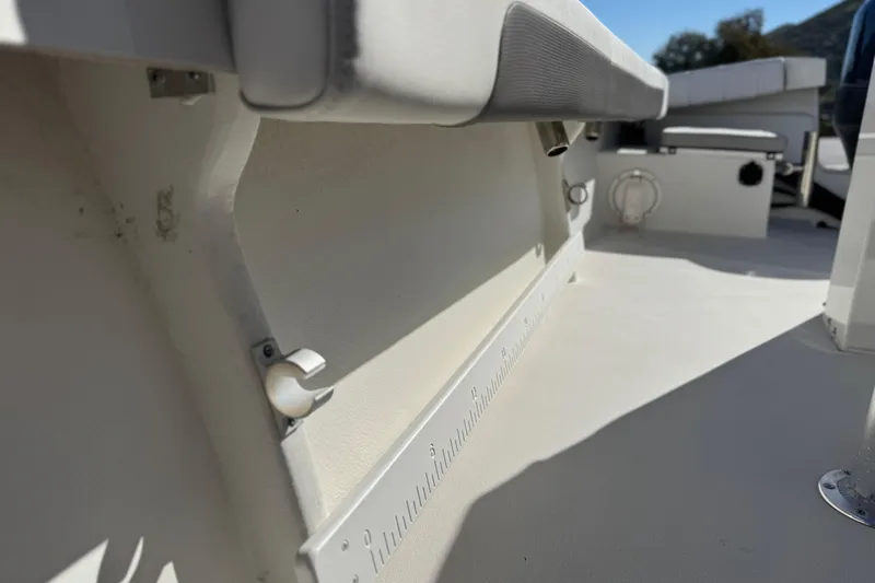 Slide: The Image of 2023 Parker 21SE Center Console boat interior with seating and measurement markings. - 21