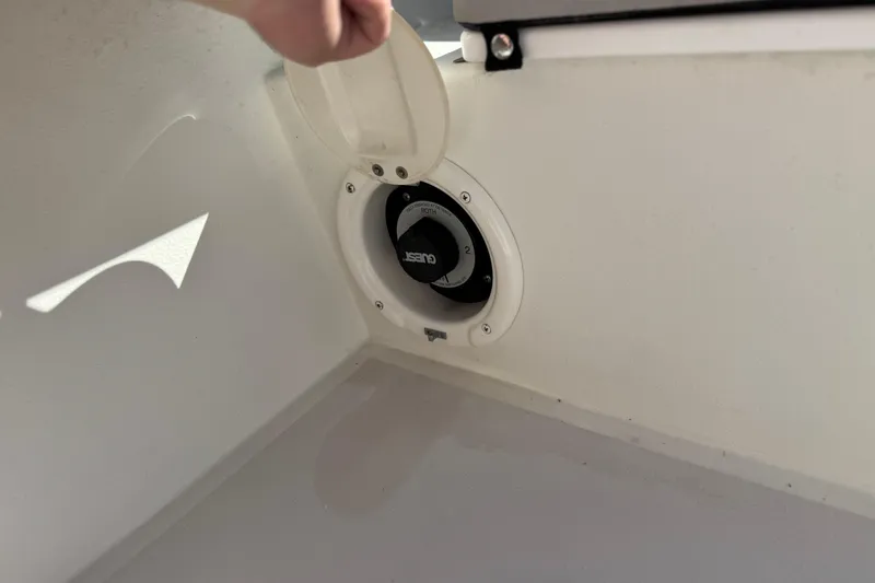 Slide: The Image of 2023 Parker 21SE Center Console boat battery switch compartment. - 24