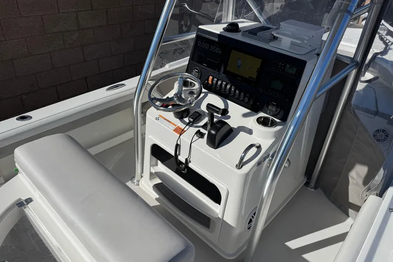 Slide: The Image of 2023 Parker 21SE Center Console boat interior with steering wheel and navigation controls. - 28