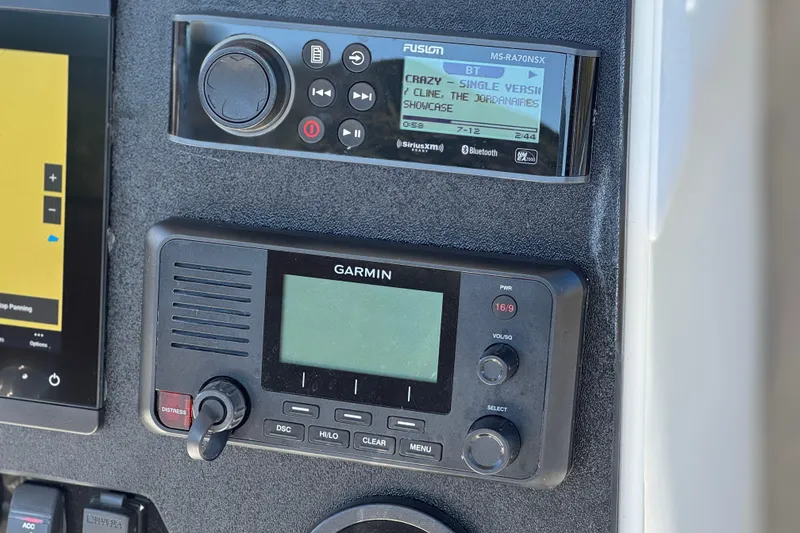 Slide: The Image of Control panel of 2023 Parker 21SE Center Console with Garmin and Fusion audio systems. - 31