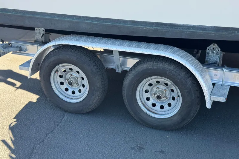 Slide: The Image of Trailer wheels of a 2023 Parker 21SE Center Console boat. - 37