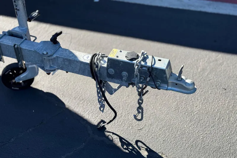 Slide: The Image of Trailer hitch of a 2023 Parker 21SE Center Console boat on pavement. - 38