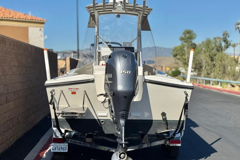 Slide: The Image of 2023 Parker 21SE Center Console boat with Yamaha 150 engine on trailer. - 4