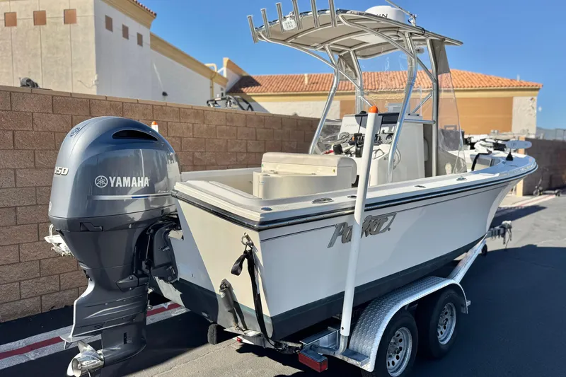 Slide: The Image of 2023 Parker 21SE Center Console boat with Yamaha engine on trailer. - 5