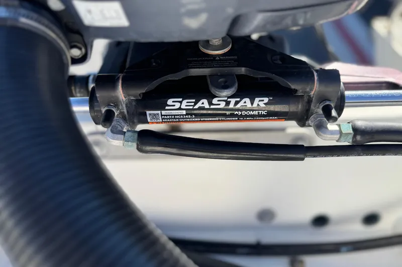 Slide: The Image of Close-up of SeaStar hydraulic steering system on 2023 Parker 21SE Center Console boat. - 8