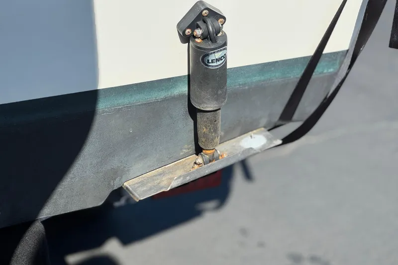 Slide: The Image of Trim tab actuator on a 2023 Parker 21SE Center Console boat. - 9