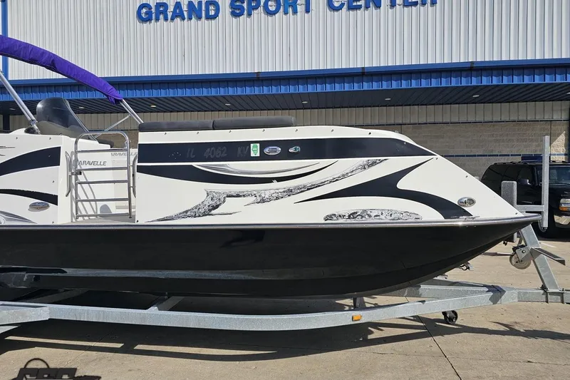 Slide: The Image of 2014 Caravelle 247 UU Razor E-Toon boat on trailer at Grand Sport Center. - 16
