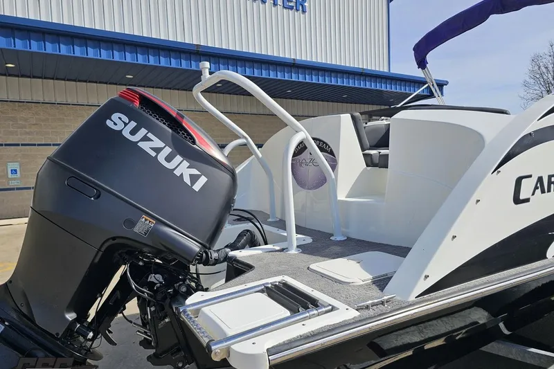 Slide: The Image of 2014 Caravelle 247 UU Razor E-Toon boat with Suzuki outboard motor. - 36