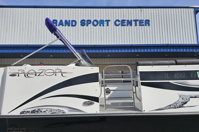 Slide: The Image of 2014 Caravelle 247 UU Razor E-Toon boat at Rand Sport Center. - 4