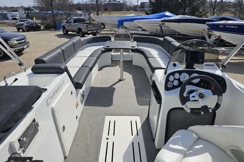 Slide: The Image of 2014 Caravelle 247 UU Razor E-Toon boat interior with seating and control panel. - 47