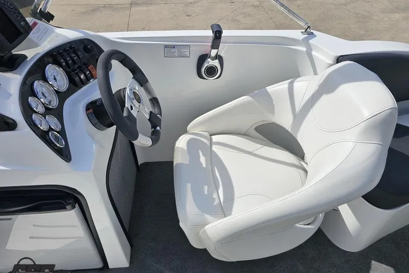 Slide: The Image of Cockpit of 2014 Caravelle 247 UU Razor E-Toon with white captain's chair and control panel. - 48