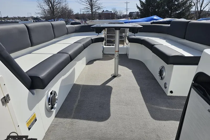 Slide: The Image of Interior of 2014 Caravelle 247 UU Razor E-Toon boat with spacious seating and table. - 54