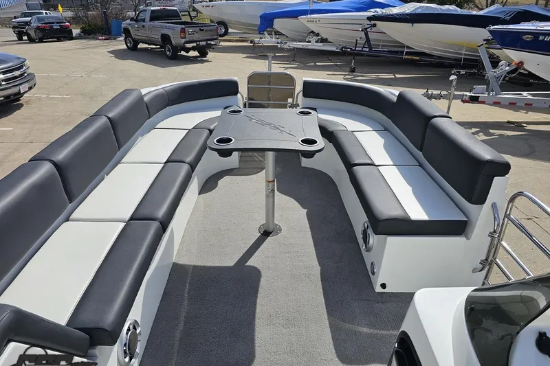 Slide: The Image of 2014 Caravelle 247 UU Razor E-Toon boat interior with spacious seating and table. - 55