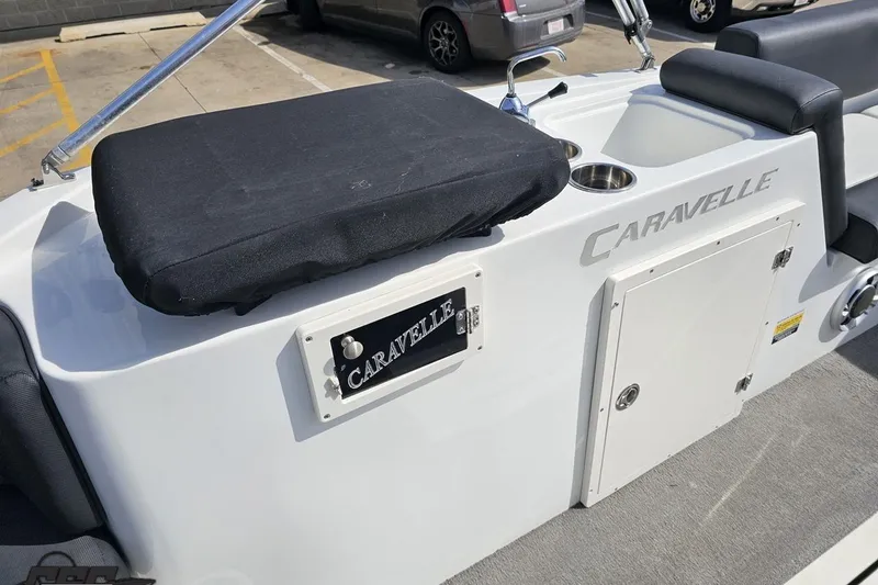 Slide: The Image of 2014 Caravelle 247 UU Razor E-Toon boat interior with seating and storage compartments. - 56
