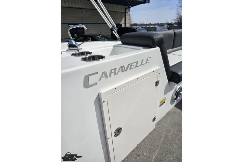 Slide: The Image of 2014 Caravelle 247 UU Razor E-Toon boat interior with seating and storage compartment. - 59