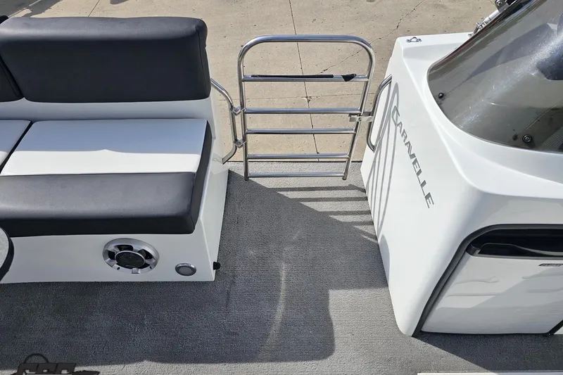 Slide: The Image of Interior of 2014 Caravelle 247 UU Razor E-Toon boat with seating and railing. - 67