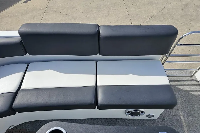 Slide: The Image of 2014 Caravelle 247 UU Razor E-Toon boat seating with black and white cushions. - 68