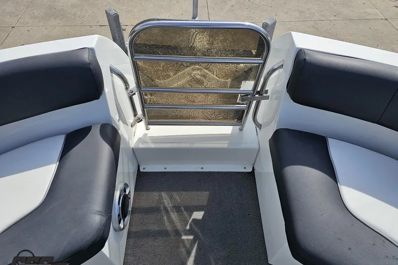Slide: The Image of Interior view of 2014 Caravelle 247 UU Razor E-Toon boat with cushioned seating. - 75