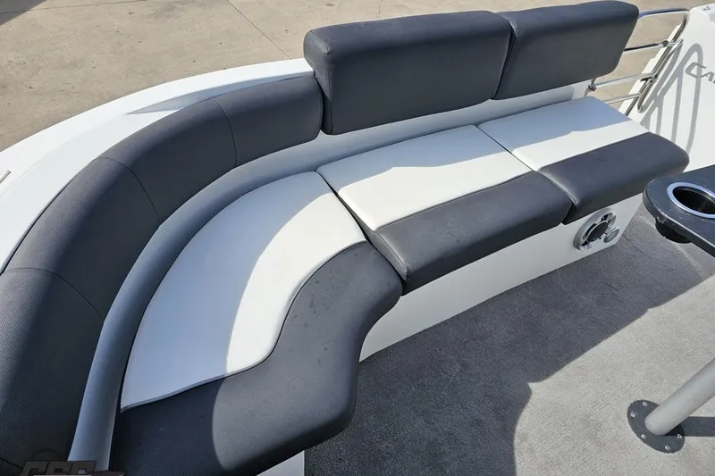 Slide: The Image of Curved seating on 2014 Caravelle 247 UU Razor E-Toon boat, featuring black and white upholstery. - 77