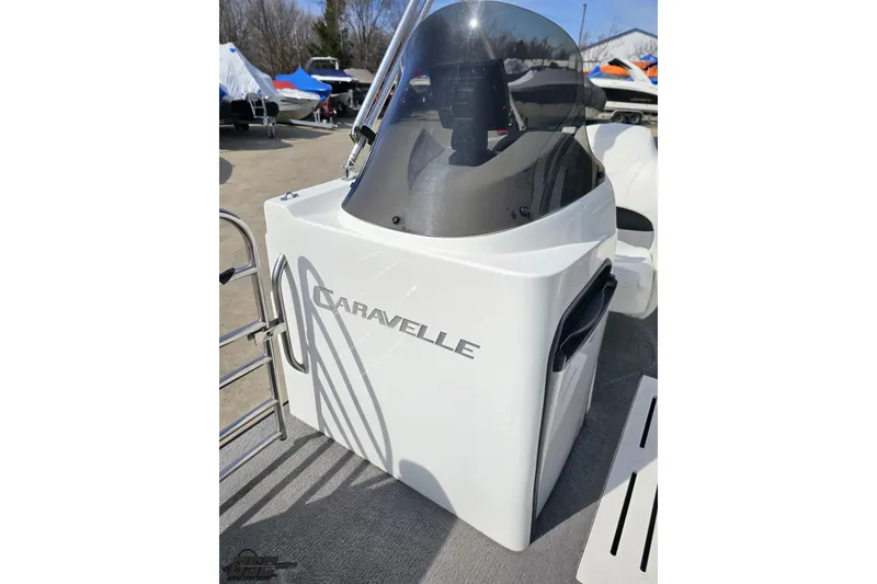 Slide: The Image of 2014 Caravelle 247 UU Razor E-Toon boat console with windshield and logo. - 80