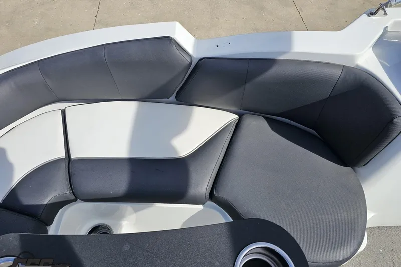 Slide: The Image of 2014 Caravelle 247 UU Razor E-Toon boat interior seating with gray and white upholstery. - 83