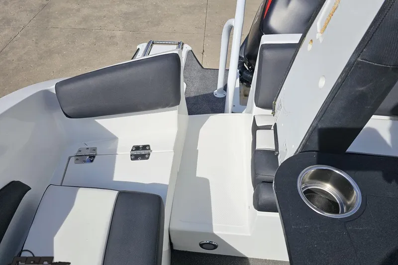 Slide: The Image of Interior of 2014 Caravelle 247 UU Razor E-Toon boat with seating and cup holder. - 84