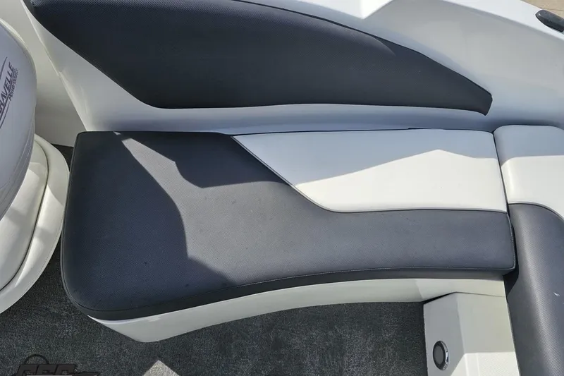 Slide: The Image of 2014 Caravelle 247 UU Razor E-Toon boat seating, featuring black and white upholstery. - 85