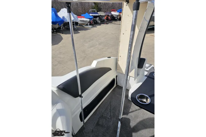 Slide: The Image of 2014 Caravelle 247 UU Razor E-Toon boat interior with seating and cup holder. - 87