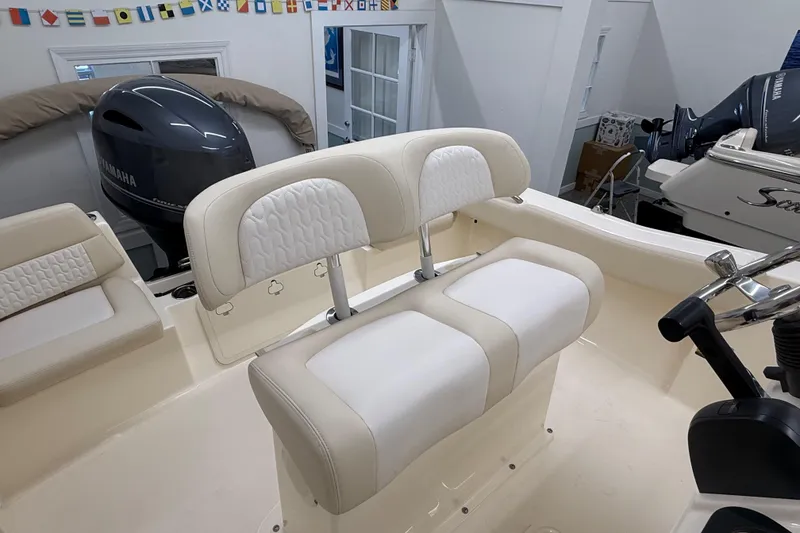 Slide: The Image of 2026 Scout 195 Sportfish boat interior with dual seating and Yamaha outboard motor. - 8